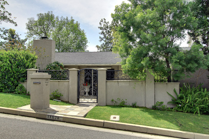 a house with a fence and a gate